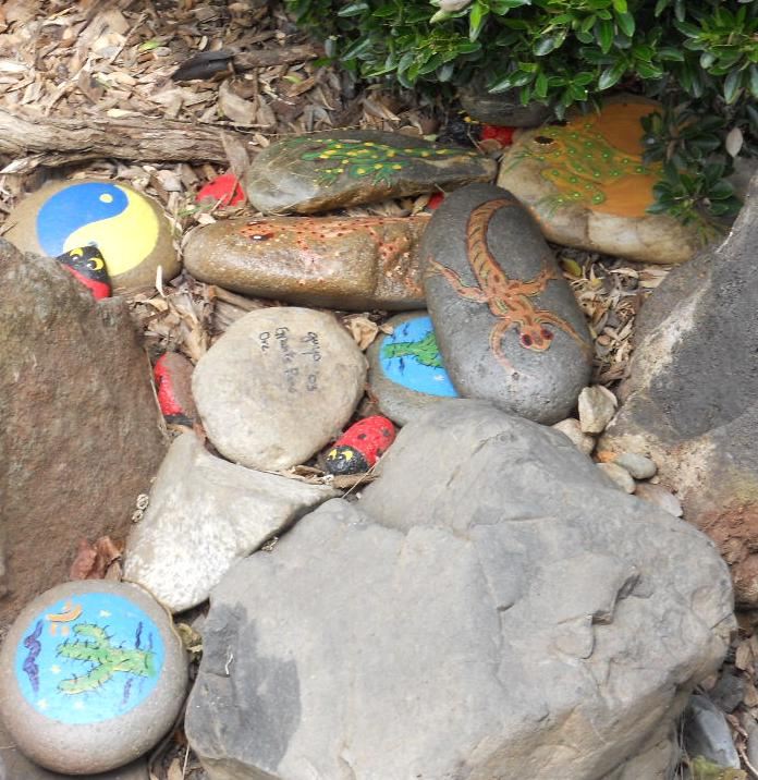 Painted stones laid in simple pattern Painted stones laid in simple pattern